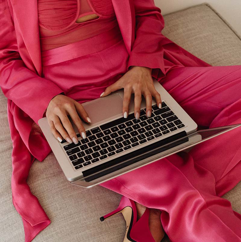 kaboompics elegant asian businesswoman in satin suit focused on laptop work elegant asian businesswoman in satin suit focused on laptop work 32063