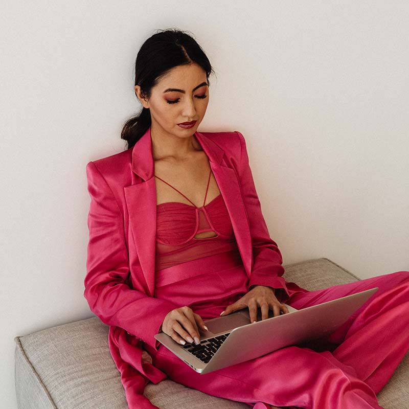 kaboompics elegant asian businesswoman in satin suit focused on laptop work elegant asian businesswoman in satin suit focused on laptop work 32066