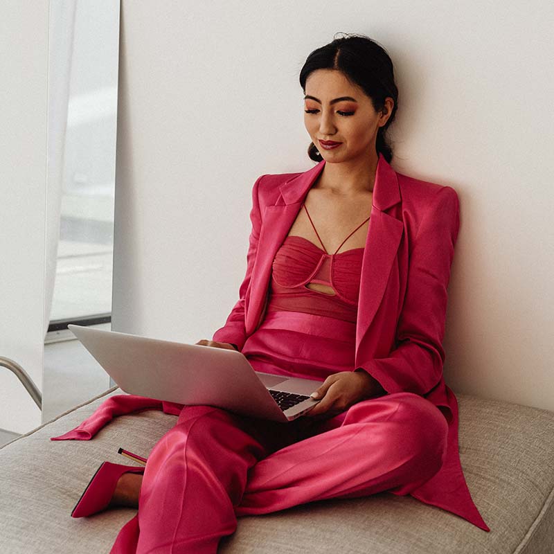 kaboompics elegant asian businesswoman in satin suit focused on laptop work elegant asian businesswoman in satin suit focused on laptop work 32068